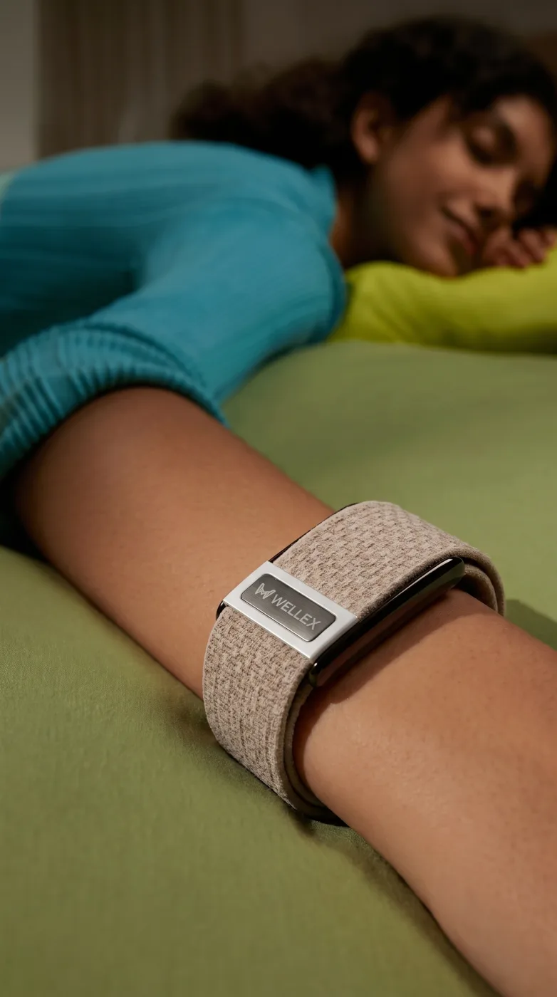 A person asleep wearing a Wellex band