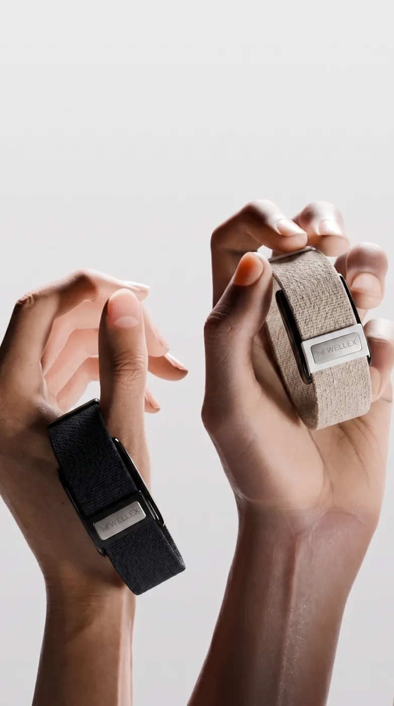 Two hands holding bands, one being passed to the other