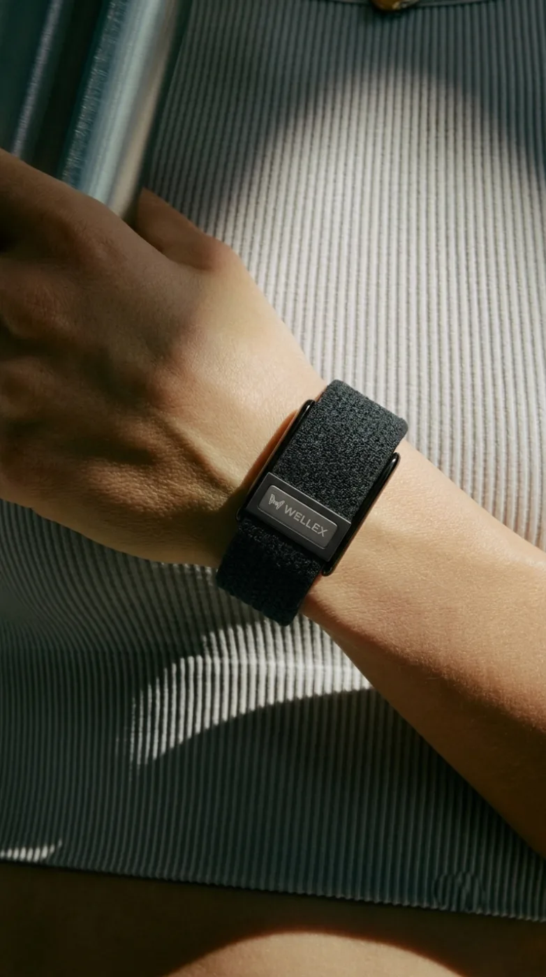 A band worn over a knitted sleeve, the wrist relaxed